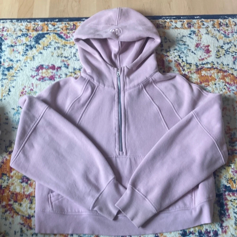 Women's jacket tag inside a pink hoodie